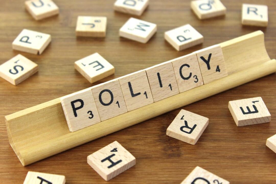 Letter tiles saying 'policy'.